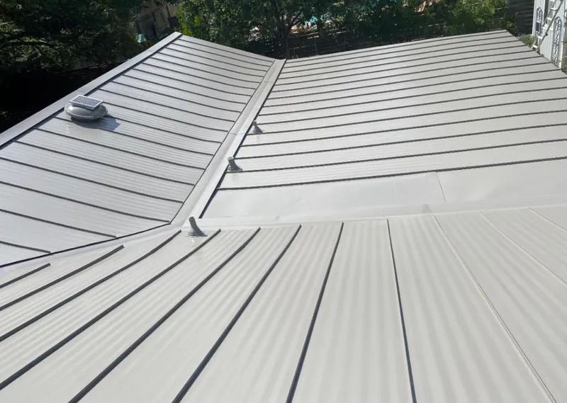 Solar attic fan installed on a metal roof for Roof Ventilation in El Dorado